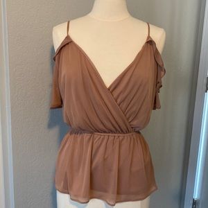 Brand new. Sheer blouse.